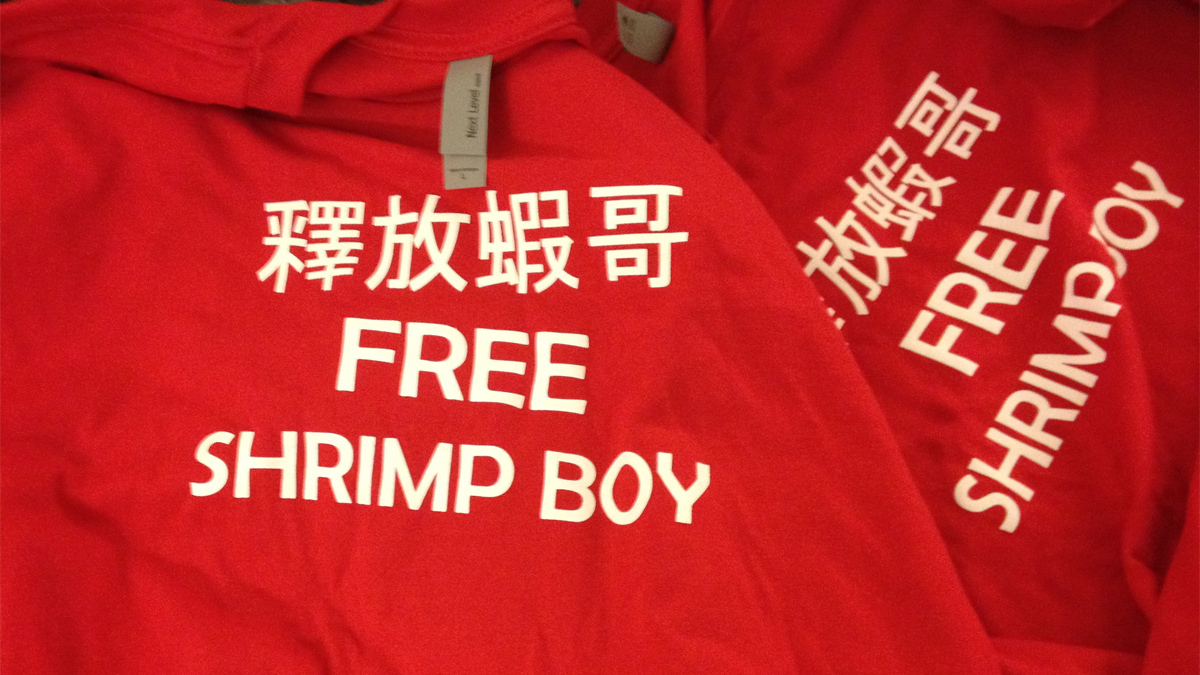 "Free Shrimp Boy" t-shirts will be distributed at a press conference Thursday afternoon by supporters of Raymond "Shrimp Boy" Chow.