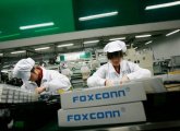 Employees work at the Foxconn factory in China.