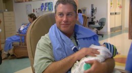 Ex-Cop Cuddles, Brings Comfort to Sick Babies