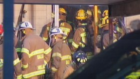 Firefighter Trapped in Condo Fire