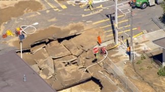 Raw Video: Water Break Leaves Huge Sinkhole