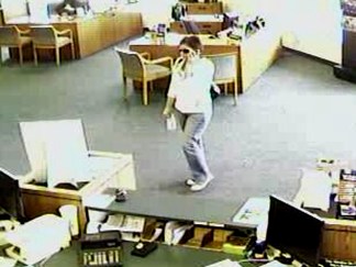 Woman on Phone Robs Bank 