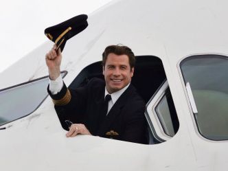 Top Gun: Travolta Piloting Aid to Haiti
