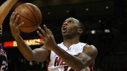 MIAMI - DECEMBER 12:  Daequan Cook #14 of the Miami Heat drives against the Atlanta Hawks at American Airlines Arena on December 12, 2008 in Miami, Florida. NOTE TO USER: User expressly acknowledges a