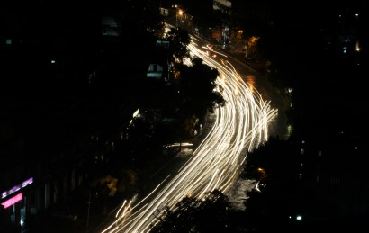 Traffic lights are the only source of light in New Delhi, India. The surrounding buildings remain in darkness for Earth Hour. 