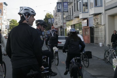 Admittedly, a bike helment would ruin Newsom's hair -- note the protective baseball cap.