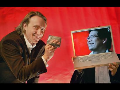 YouTube cofounders Chad Hurley, 29, left, and Steven Chen, 27, pose for a photo with their laptops at their office loft in a San Mateo, Calif.  