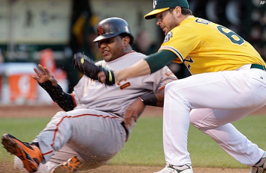 Godfrey Outpitches Lincecum, A's Top Giants 5-2