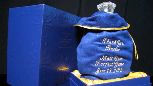 Cain Gives Teammates Crown Royal