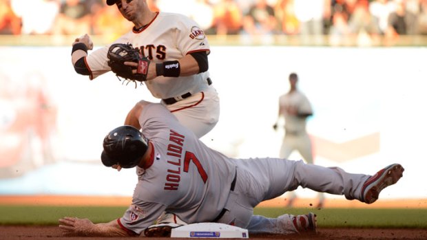 Holliday, Cards Defend Dirty Slide