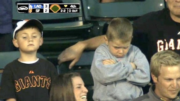 Young Giants Fan Pouts After Whiffing Ball