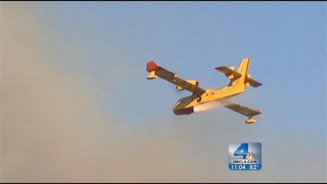 Firefighters are working to contain a brush fire that broke out Friday afternoon in the Sepulveda Pass. The fire is burning on the east side of the pass, but is not threatening any homes. Arson investigators are on scene. Lolita Lopez reports from the Sepulveda Pass for the NBC4 News at 11 p.m. on Sept. 14, 2012.