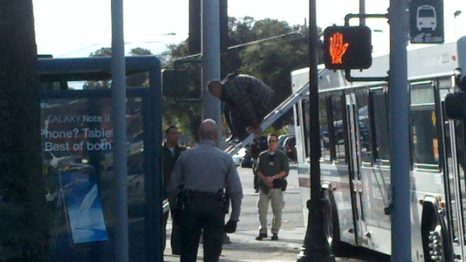 After a four-hour negotiation with crisis intervention specialists, an obviously distraught man climbed down a VTA bus where he had climbed up in search of finding help. Marianne Favro reports.