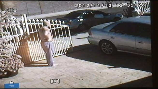 In this surveillance video, a man can be seen pleading with a home owner to let him go after a bungled burglary in Arleta on Tuesday, Nov. 13, 2012.
