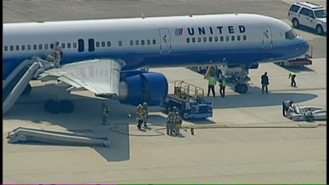 A United Airlines flight bound for San Francisco had to be evacuated when smoke was detected in the cabin.  Passengers exited the aircraft via inflatable slides.