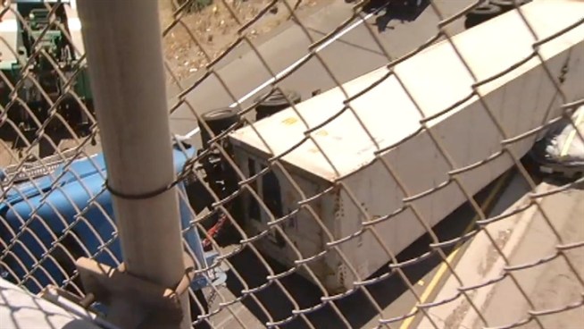 A woman was killed Thursday morning when a driver carrying a load of broccoli  likely went too fast around a curve, lost control and his trailer fell onto her Toyota, according to the California Highway Patrol.