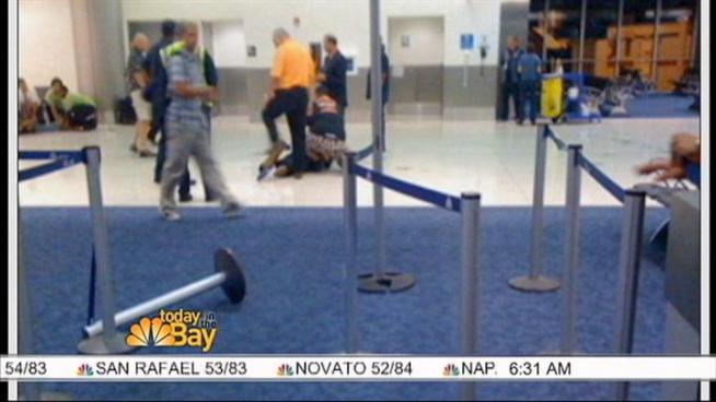 Two men aboard an American Airlines flight from Miami headed to SFO arrested Wednesday night for allegedly punching one of the pilots in the face. Damian Trujillo has the first look at the suspects and images from inside the plane.