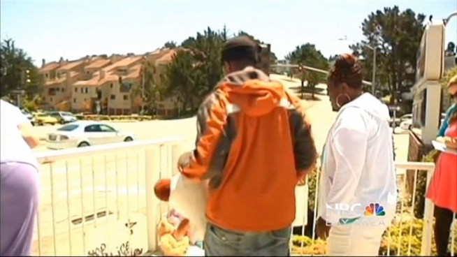 A large group gathered in South San Francisco at a gas station where a 15 year old boy was shot and killed by a police officer.