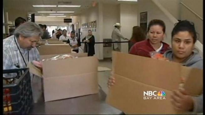 Volunteers at Sacred Heart Community Service in San Jose are handing out thousands of turkeys and other donated foods to the needy, and they're doing it with less government funding.  NBC Bay Area's Marianne Favro reports from San Jose.