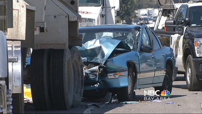 A 72-year-old woman died Tuesday on a highway near Cupertino, after her Regal Buick rear-ended a big rig whose driver got out of vehicle to help another overturned big rig, according tot he California Highway Patrol.