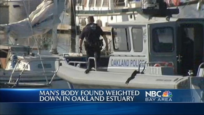 A body found weighted down in the Oakland Estuary was found around 6:30 this morning.