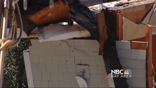 A Marin County couple buys adjacent carriage house and tears it down to create a better view.