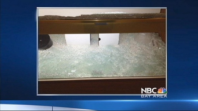 Newark police are looking for four armed suspects who smashed display cases and fired shots during a robbery at a jewelry store at the NewPark Mall this afternoon, a police spokesman said.