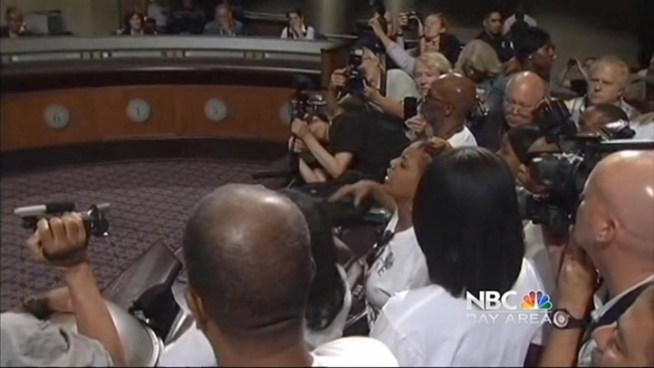 Councilman finally turned over the police report on death of Alan Blueford who was shot and killed by officers, after protesters disrupt the Oakland City Council meeting Tuesday. Jean Elle reports.