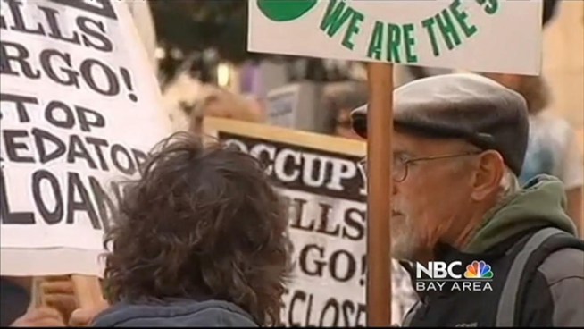 Several hundred protesters with Occupy San Francisco have gathered in front of the Wells Fargo headquarters in San Francisco's Financial District this evening on the first anniversary of the Occupy Wall Street protests.