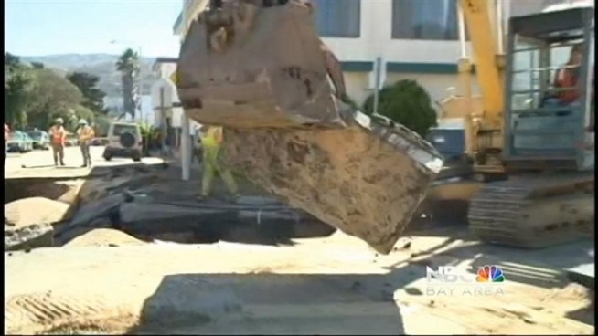 San Francisco firefighters are working on stopping the flow of a water main break in the Visitacion Valley neighborhood.