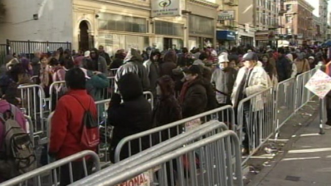 Christie Smith reports from Glide Memorial Church as some 5,000 people turnout for the annual Christmas food bag giveaway.
