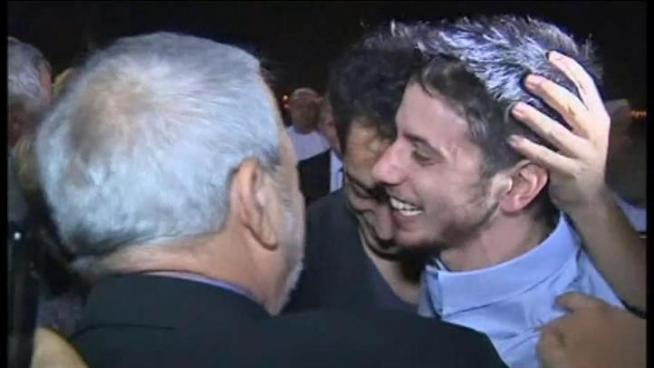 The tarmac welcome at the bottom of a plane staircase was one two years in the making and the emotions showed it.