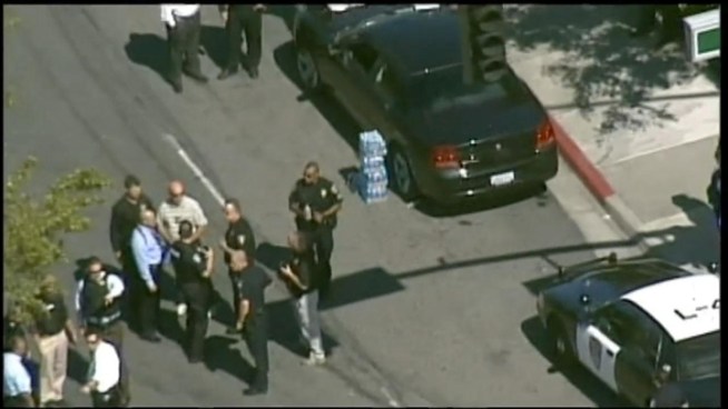 Four people were shot, including a female security guard and a Pinole police officer, during a robbery attempt of an armored car outside a Well's Fargo bank.