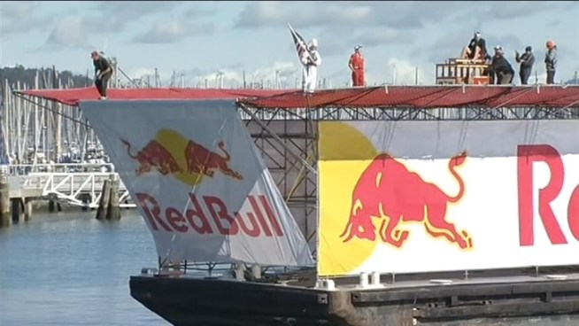 Watch NBC Bay Area's Bob Redell ride a Red Bull Flugtag and jump into the bay.  He's wearing a helmet, tie and red swim trunks. A flugtag means 