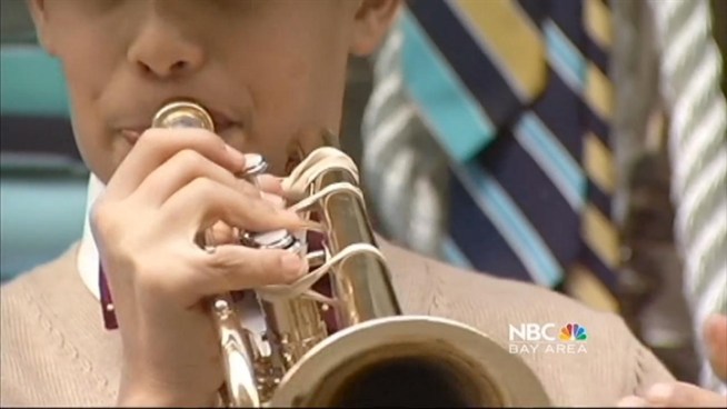 A 12 year old boy in a Brooks Brothers suit is capturing the hearts of Bay Area residents who hear him play his trumpetin downtown San Francisco.