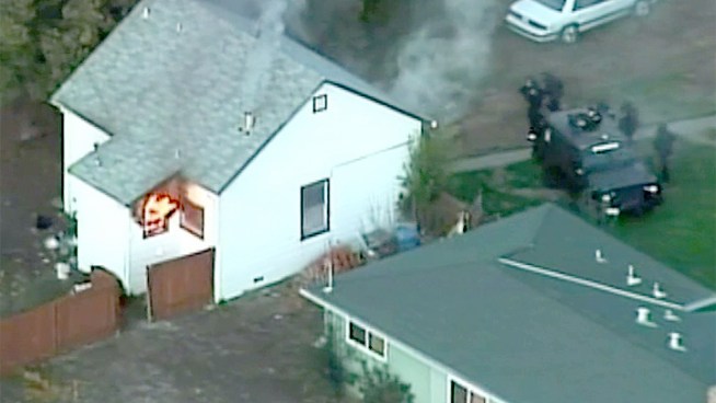 An armed robbery in Vallejo Friday afternoon left one injured and led to a standoff with police at a house that caught fire.