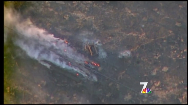 One person has died in a fast-moving brush fire that burned 30 homes near Campo in San Diego's East County.