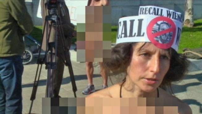 Four protesters were arrested entirely in the buff as they took to the steps of San Francisco City Hall in a brazen challenge of the city's ban on public nudity on Friday, the first day it went into effect.