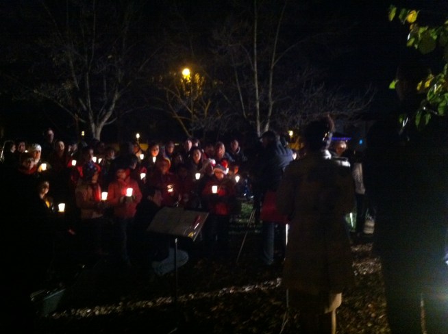 Kris Sanchez talks to the people behind a Tuesday night candlelight vigil in Pleasanton to remember the victims of the school shooting in Connecticut.
