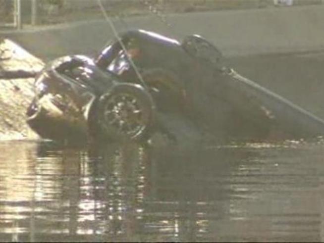 The suspect's car which was pulled from a <a title=