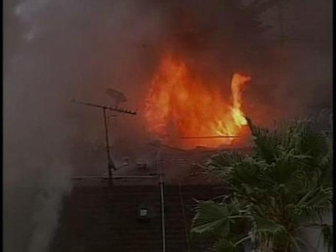 A fire burns the <a title=
