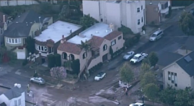 Nearly two dozen homes and a number of cars were damaged by  flooding after a water main ruptured in San Francisco's Inner Parkside  neighborhood.