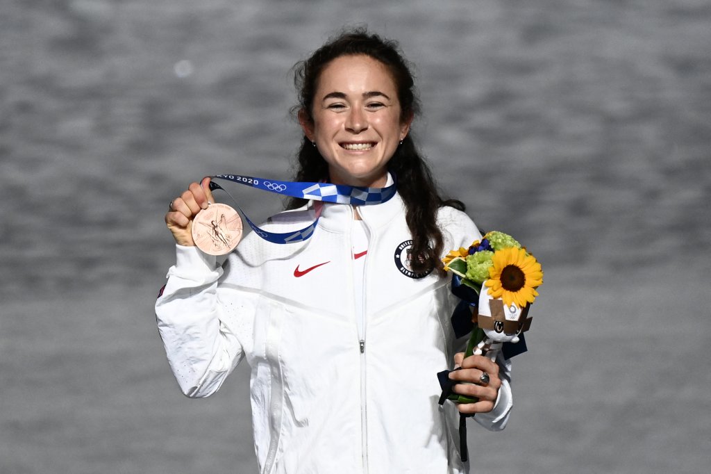 Team USA's Molly Seidel celebrates on the podium during the victory ceremony of the women's marathon event during the Tokyo 2020 Olympic Games closing ceremony at the Olympic Stadium in Tokyo on Aug. 8, 2021.