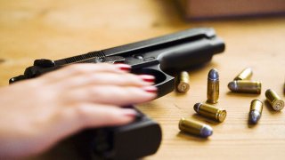 091510 woman gun handgun pistol generic