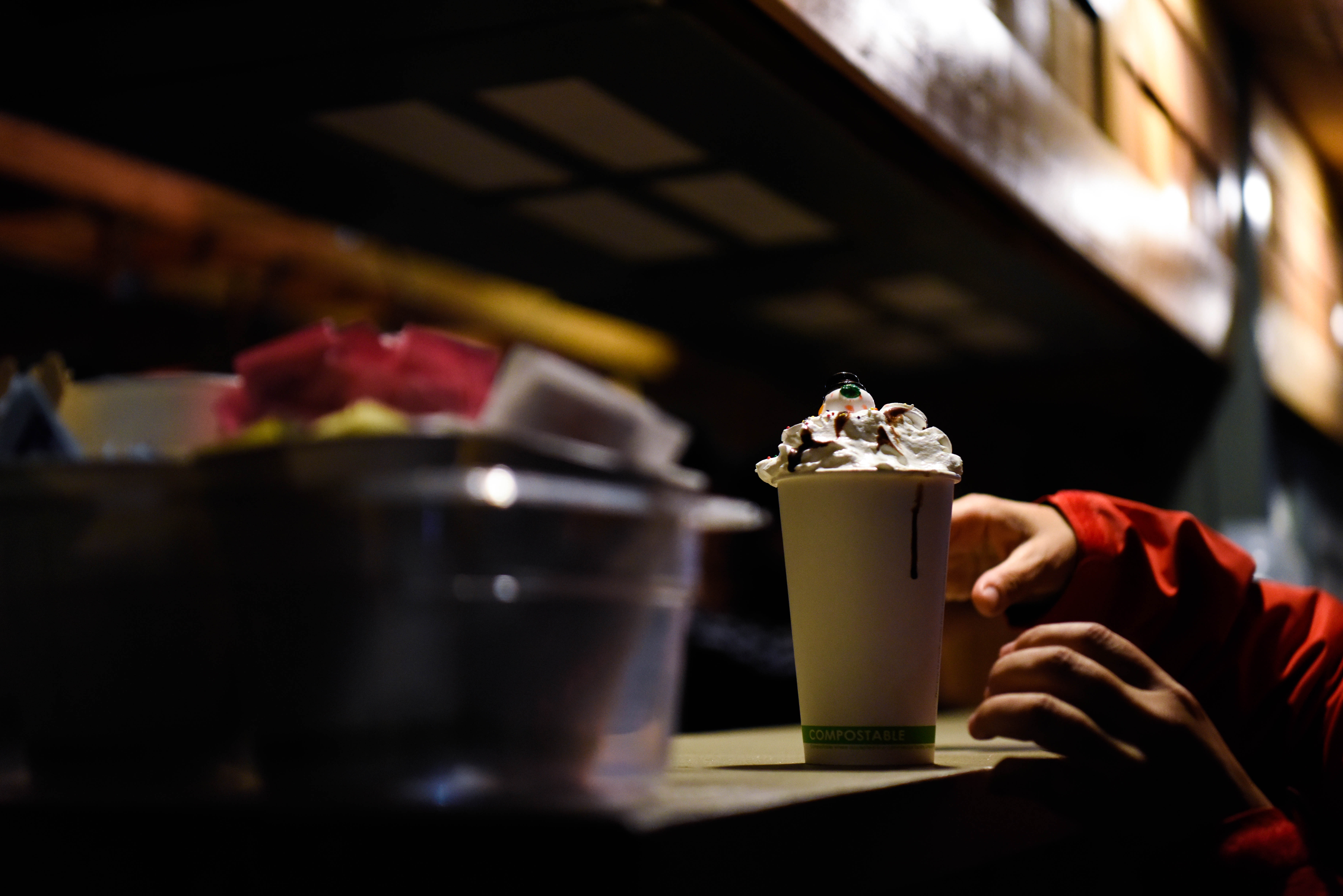 People line up to get the coveted snowman hot chocolate at Christmas in the Park in downtown San Jose. (Dec. 6, 2019)