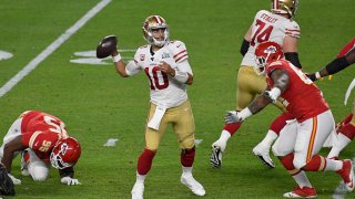 Jimmy Garoppolo #10 of the San Francisco 49ers looks to pass against the Kansas City Chiefs in Super Bowl LIV at Hard Rock Stadium on February 02, 2020 in Miami, Florida. The Chiefs won the game 31-20. (Photo by Focus on Sport/Getty Images)