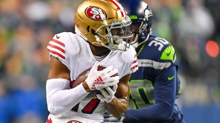 49ers receiver Emmanuel Sanders breaks a tackle.