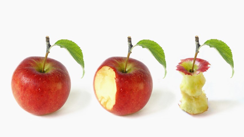 Whole apple, apple with a bite taken out of it and an apple core