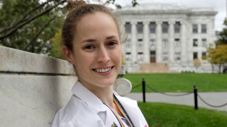 In this Thursday, Oct. 17, 2019, photo Harvard Medical School student Aliya Feroe, of Minneapolis, Minn., poses on the school's campus, in Boston. Some medical schools are making a big push to recruit LGBTQ students, backed by research showing that patients often get better care when treated by doctors who are more like them.