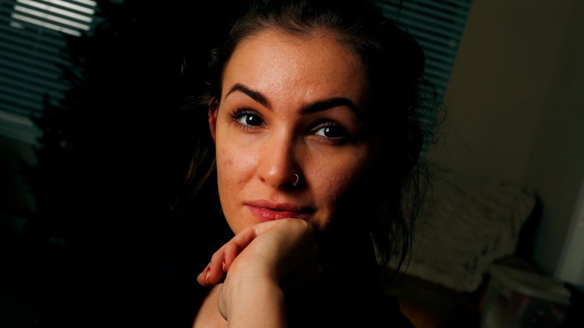 In this Dec. 13, 2019, photo, Caroline Miller poses for a photo in Cartersville, Ga. Miller is one of more than a dozen women who jointly filed a lawsuit against Lyft after she says she was raped by a driver after a night out celebrating her birthday. (AP Photo/John Bazemore)